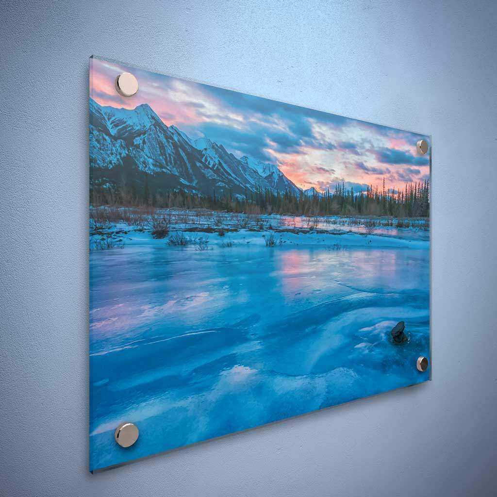 Panoramic acrylic print of a frozen mountain landscape with high-gloss UV finish and chrome mounts.