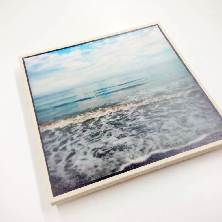 Custom wood photo printing in Dubai featuring a UV printed beach landscape on natural wood.