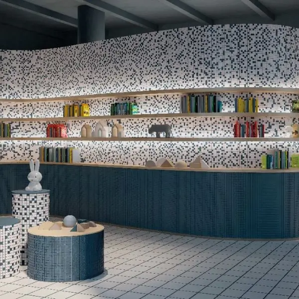 Creative interior design Dubai for a library featuring pixelated wall patterns and blue shelving
