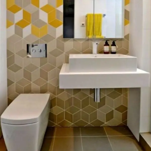Luxury bathroom interior design Dubai with geometric wall tiles and a modern floating vanity