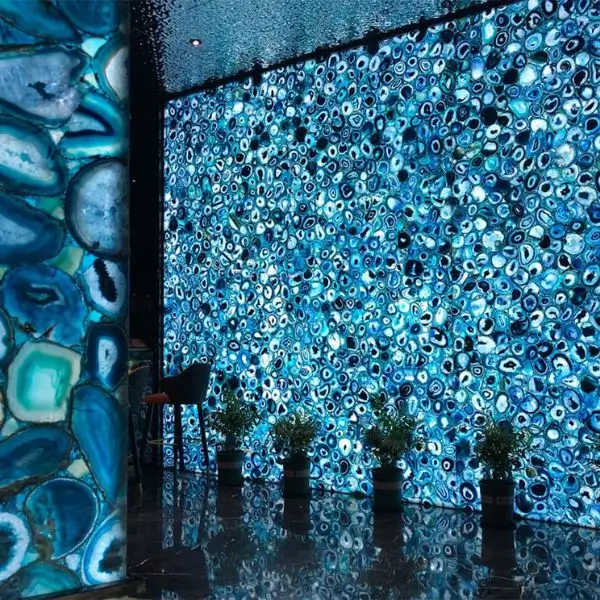 Luxury interior design Dubai featuring a stunning backlit blue agate gemstone feature wall