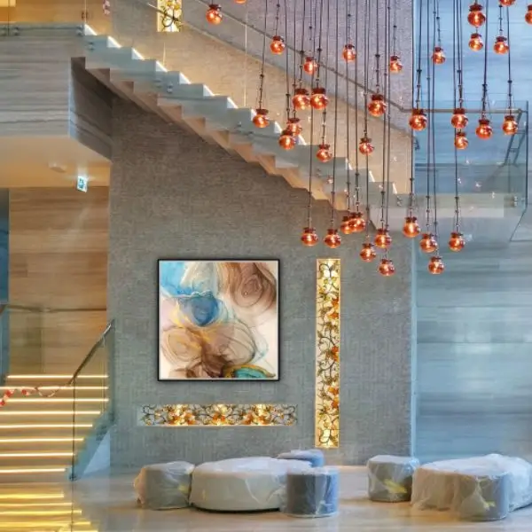 Modern lobby interior design Dubai featuring a grand staircase and luxury lighting